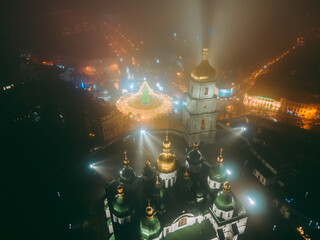 Obraz na płótnie Canvas Aerial view from drone at St. Sophia's Cathedral at winter night in fog in Christmas