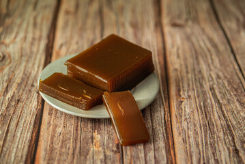 apple marmalade on a plate on a wooden table background