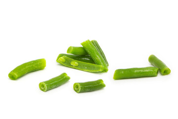 Fresh organic sliced green beans in heap, whole and halves isolated on white background.	