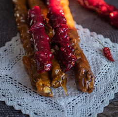 oriental sweet with nuts - churchkhela on a wood background