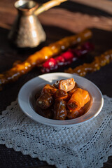oriental sweet with nuts - churchkhela on a wood background