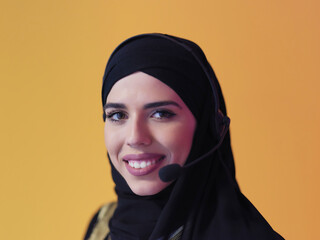 Portrait of young muslim woman with headphones