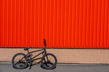 BMX bicycle near red wall - 419704031