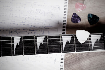 Guitar, picks and note sheet