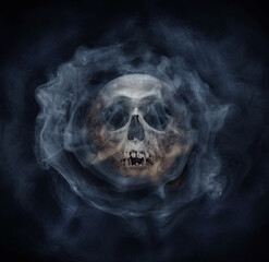 A skeleton's skull and smoke. Horror stories,  phantom,  apparition:, wraith, spook, shadow, illusion, phantasm background. Old gothic style.