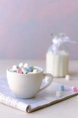 Fototapeta na wymiar Hot morning coffee with milk and mini marshmallows