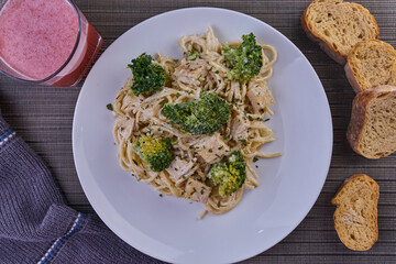 Rich breakfast of spaghetti with broccoli and chicken