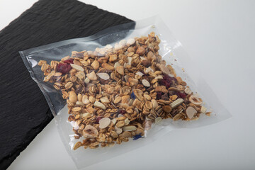 Granola with nuts in vacuum sealed plastic packaging