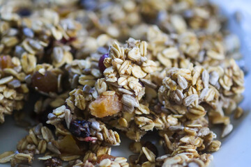 Organic granola cereal with oats and dried fruits.