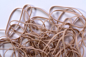 A pile of elastic rubber bands on white background