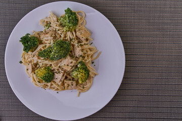 Rich breakfast of spaghetti with broccoli and chicken