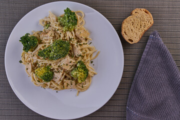 Rich breakfast of spaghetti with broccoli and chicken