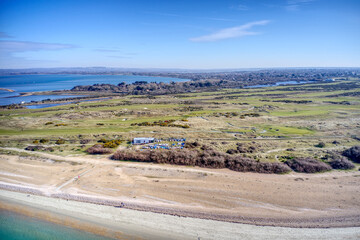 Aerial view of Hayling Island Golf Course a links course on the western tip of Hayling Island and next to the sea entrance to Langston Harbour with the Kench nature reserve on the north side.