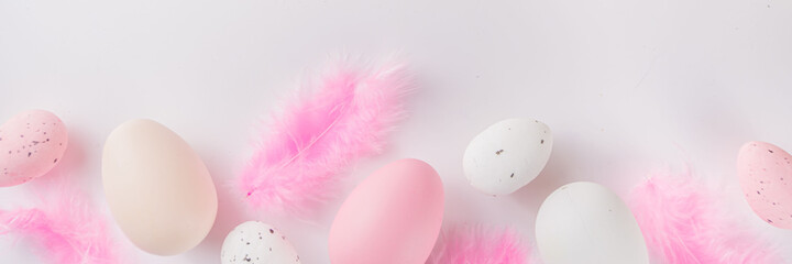Flatlay of Easter eggs and feathers