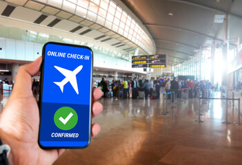 The hand of a man holding a mobile phone with the online check in confirmation message on the...