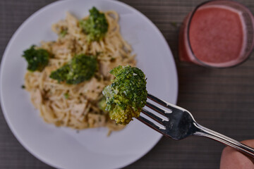 Rich breakfast of spaghetti with broccoli and chicken