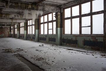 a frozen factory floor without glass stands empty