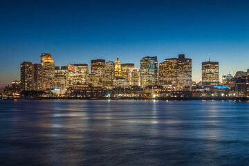 Fototapeta na wymiar USA, Massachusetts, Boston. City skyline from Boston Harbor at dusk.