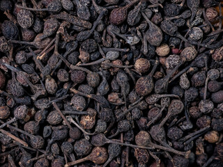 macro shot of  bourbon pepper from Madagaskar. in detail and with high magnification and very close. Ideal food and spice background