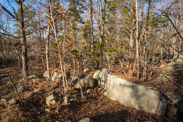 USA, Massachusetts, Cape Ann, Gloucester. Dogtown Rocks, inspirational saying carved on boulders in the 1920's, now in a pubic city park, sign for the Moraine