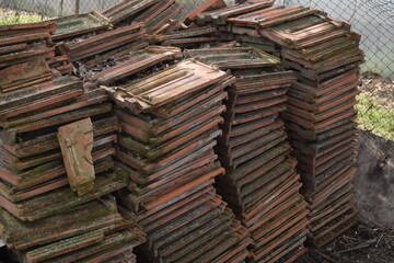 Old roof tiles in stacks.