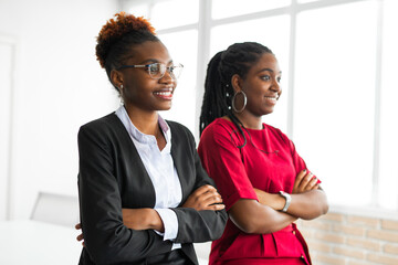 two beautiful african young women in the office 