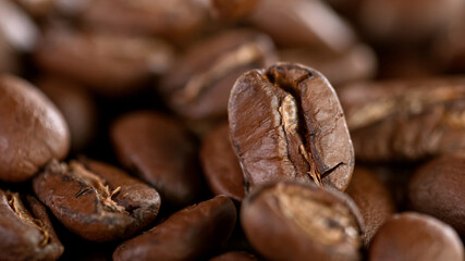 Falling Roasted Coffee Beans, Macro Shot, close-up.