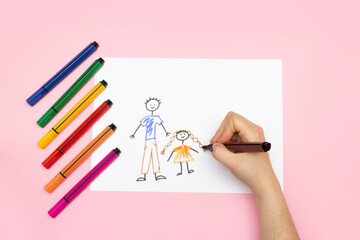 DIY drawing, child's drawing family - dad, mom and me. Children's creativity concept