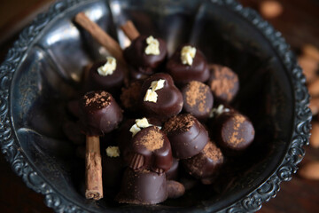 Homemade chocolate candies. Brown background. Healthy sweets. Home cooking. 