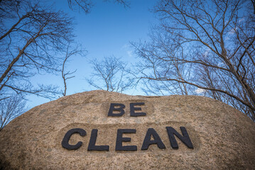 USA, Massachusetts, Cape Ann, Gloucester. Dogtown Rocks, inspirational saying carved on boulders in the 1920's, now in a pubic city park, 'Be Clean'.