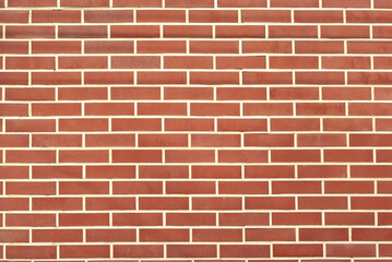 Texture of brick wall. new brickwork. Samples of wall or fence are presented at exhibitions. Orange brick close up.