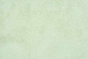 Plaster on a yellow wall. Concrete wall texture close up.