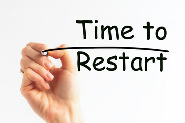 Hand writing inscription TIME TO RESTART with marker, concept, stock image