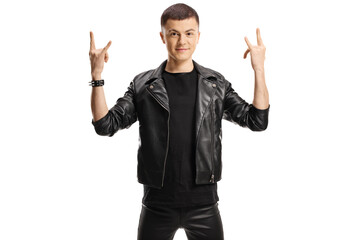 Teenage guy in leather jacket gesturing rock and roll sign