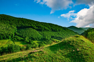 Fototapeta na wymiar the mountain green valley with blue sky