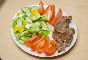 Fototapeta na wymiar Grilled meat with vegetables
