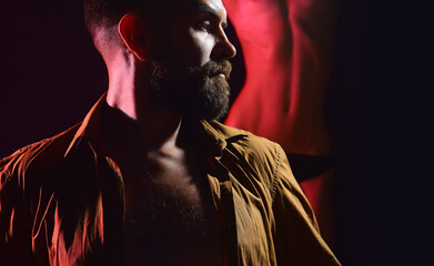 Sexy man relax in strip club. Couple, naked woman, unshaven brutal bearded man near female body....