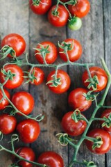 red cherry tomatoes on wooden background