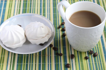 cup of coffee with milk and marshmallow. Morning breakfast. coffee beans
