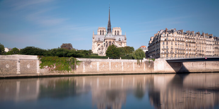 France, Ile-de-France, Paris, Long exposure of Seine canal with Notre-Dame de Paris in background