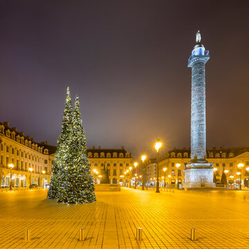 France, Ile-de-France, Paris, Christmas trees at illuminated Place&Ocirc;&oslash;&Omega;Vendome during night