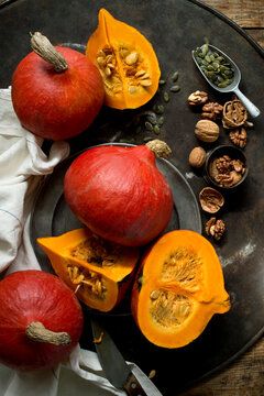 Walnuts, pumpkin seeds and red&Ocirc;&oslash;&Omega;kuri&Ocirc;&oslash;&Omega;squashes on rustic baking sheet