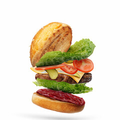 Delicious burger with flying ingredients isolated on white