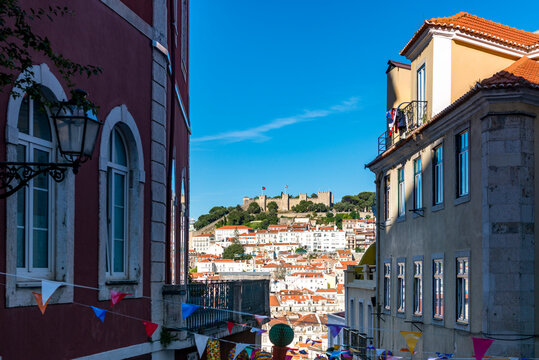 Portugal, Lisbon, Old town buildings with So Jorge Castle in distance