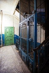 Old vintage rusty elevator gates in old mansion © Mulderphoto