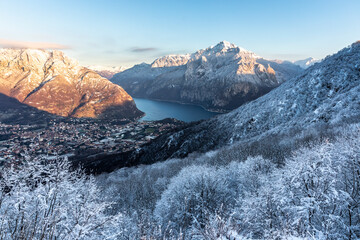 Italy, Lecco, Lake Como, View of mountains and lake in valley on winter day
