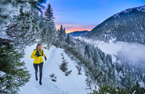 Woman running on mountain path at Heimgarten, Bavaria, Germany