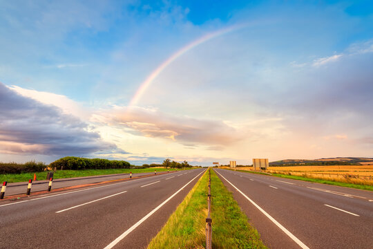UK, Scotland, East Lothian, Double rainbow over empty highway