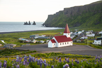 View of the coastal town of Vik in Iceland on a summer evening