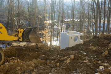 Construction of new road in a excavator digs and moving the ground